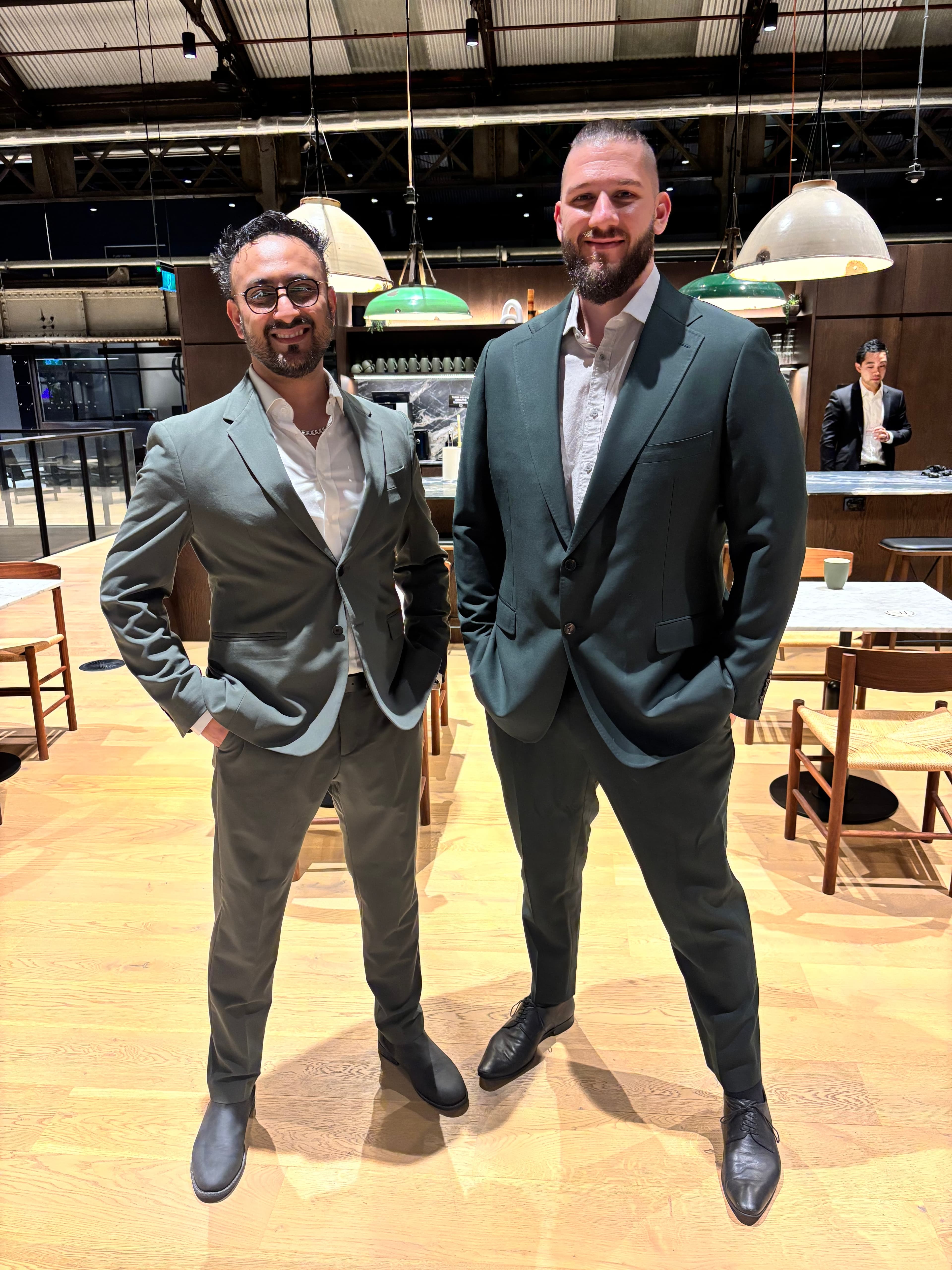 Daniel standing alongside a colleague at a venue event.